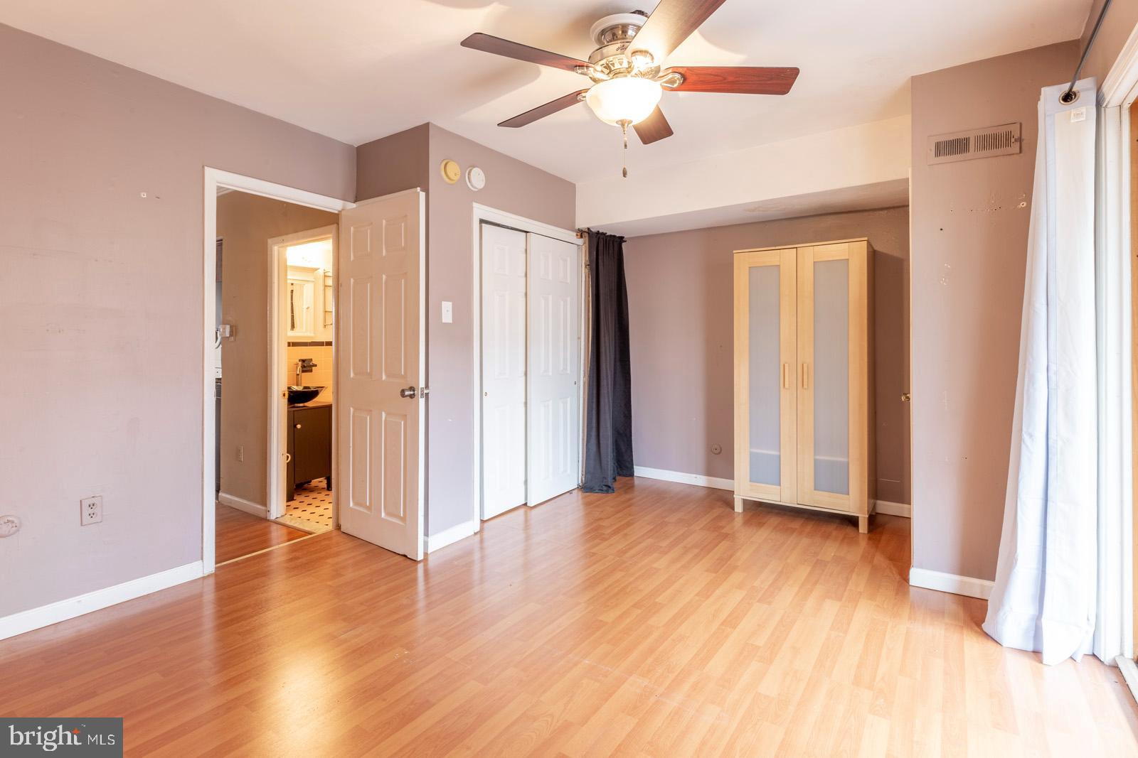 1120 Rodman Street, Unit 2 Philadelphia, PA 19147 - Photo 13 of 18 wooden floor in an empty room with a window