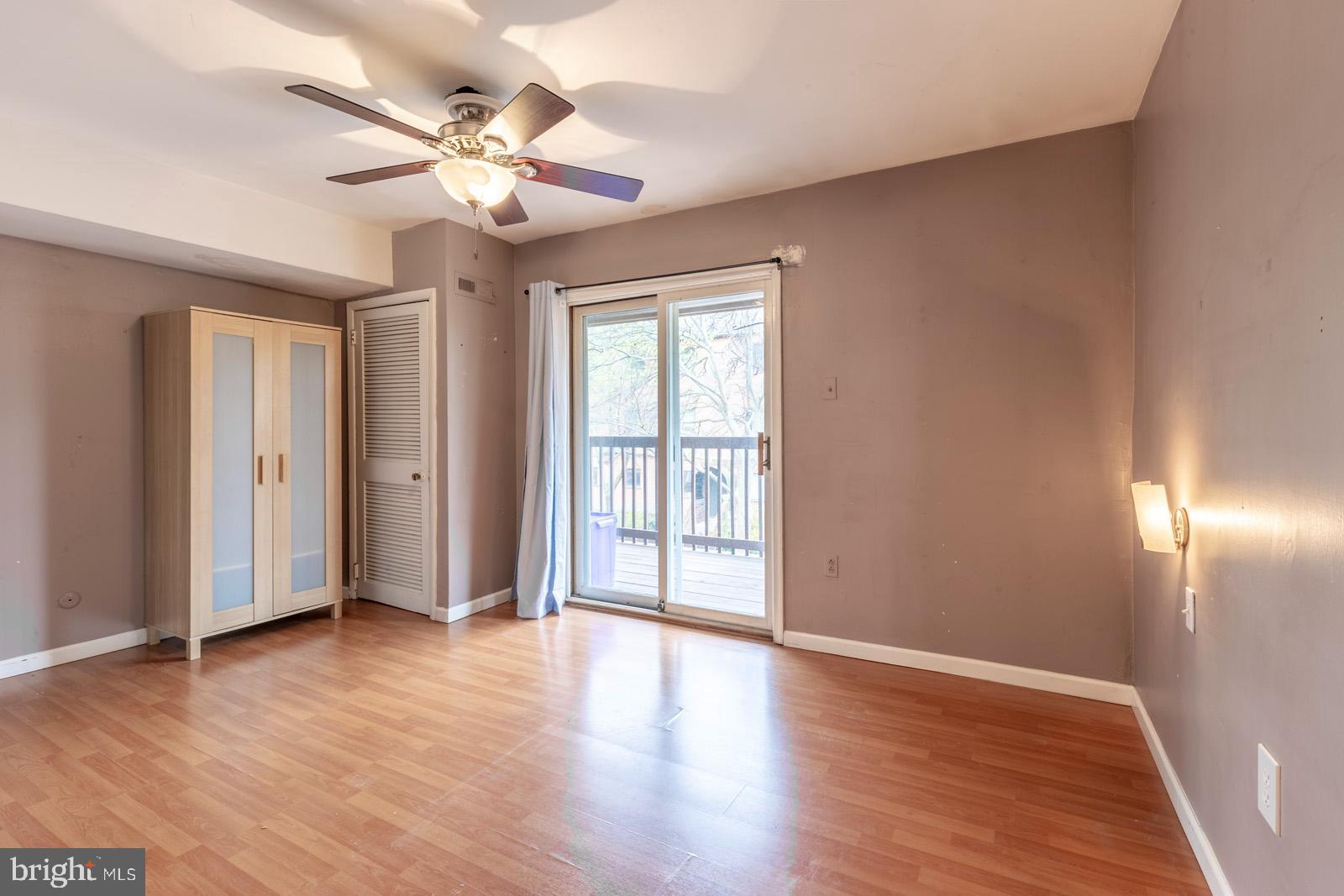 1120 Rodman Street, Unit 2 Philadelphia, PA 19147 - Photo 14 of 18 a view of an empty room with wooden floor and a window