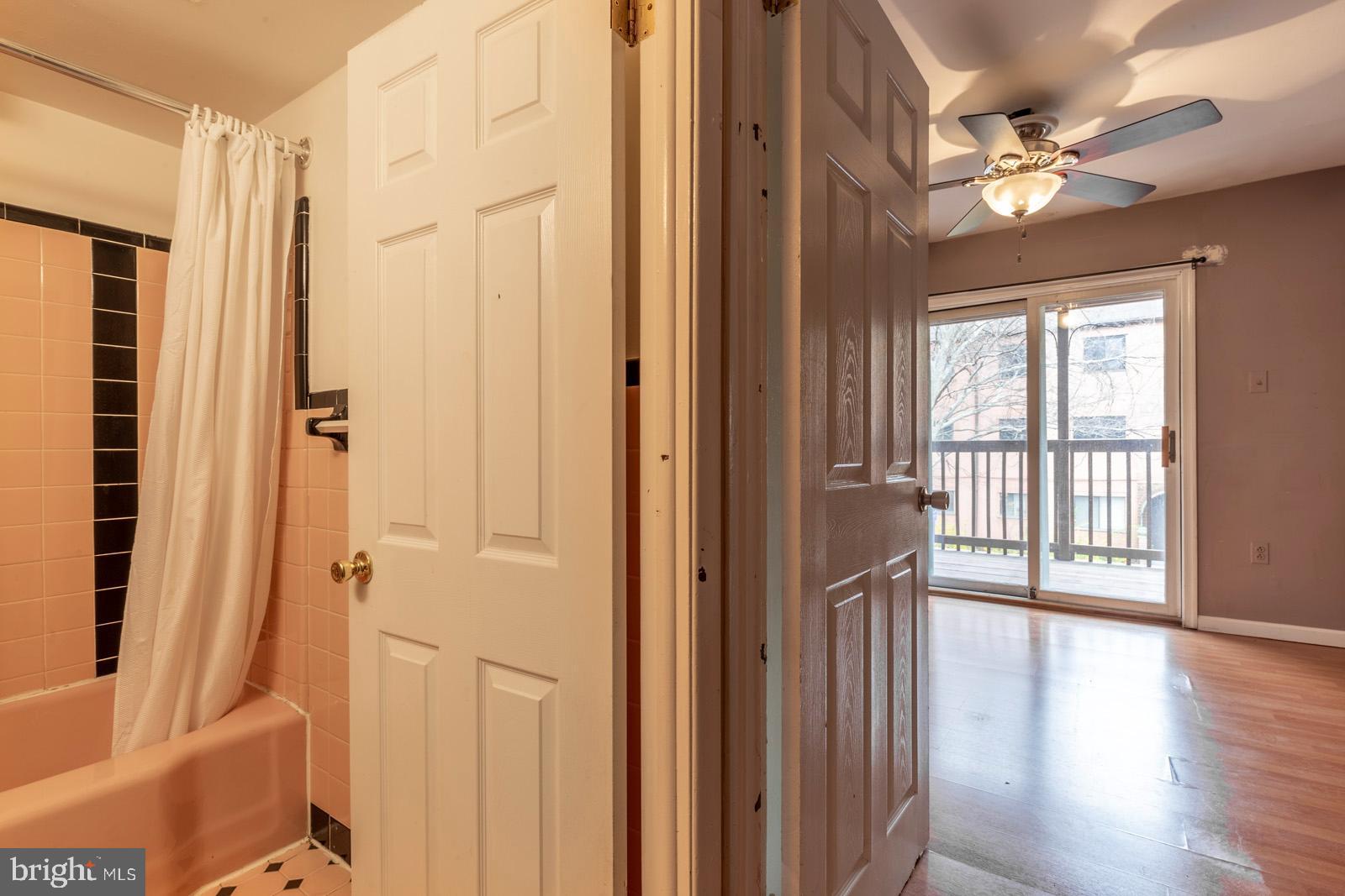 1120 Rodman Street, Unit 2 Philadelphia, PA 19147 - Photo 8 of 18 a view of a hallway with wooden floor and windows