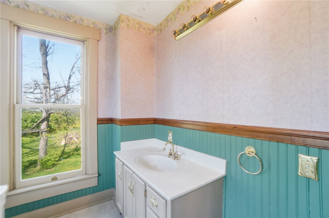 1444 Eagle City Road Springfield, OH 45504 - Photo 37 of 50 This bathroom features a window overlooking lush greenery, offering a refreshing view.