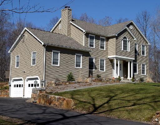 12 Greenbriar Road Oxford, CT 06478 - Photo 1 of 1 a front view of a house with a yard