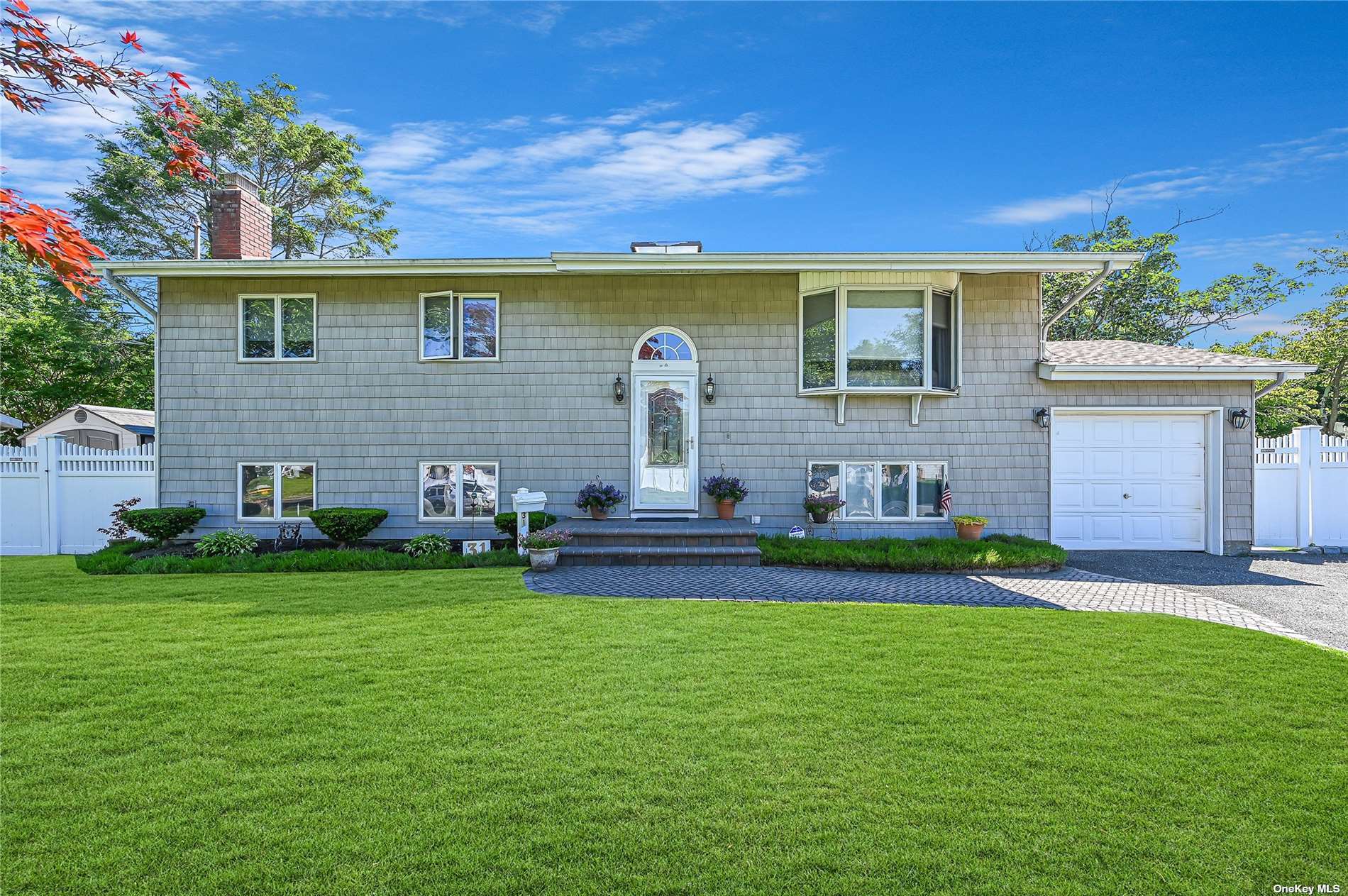 31 Ridge Road Wheatley Heights, NY 11798 - Photo 1 of 1 a front view of house with yard outdoor seating and green space