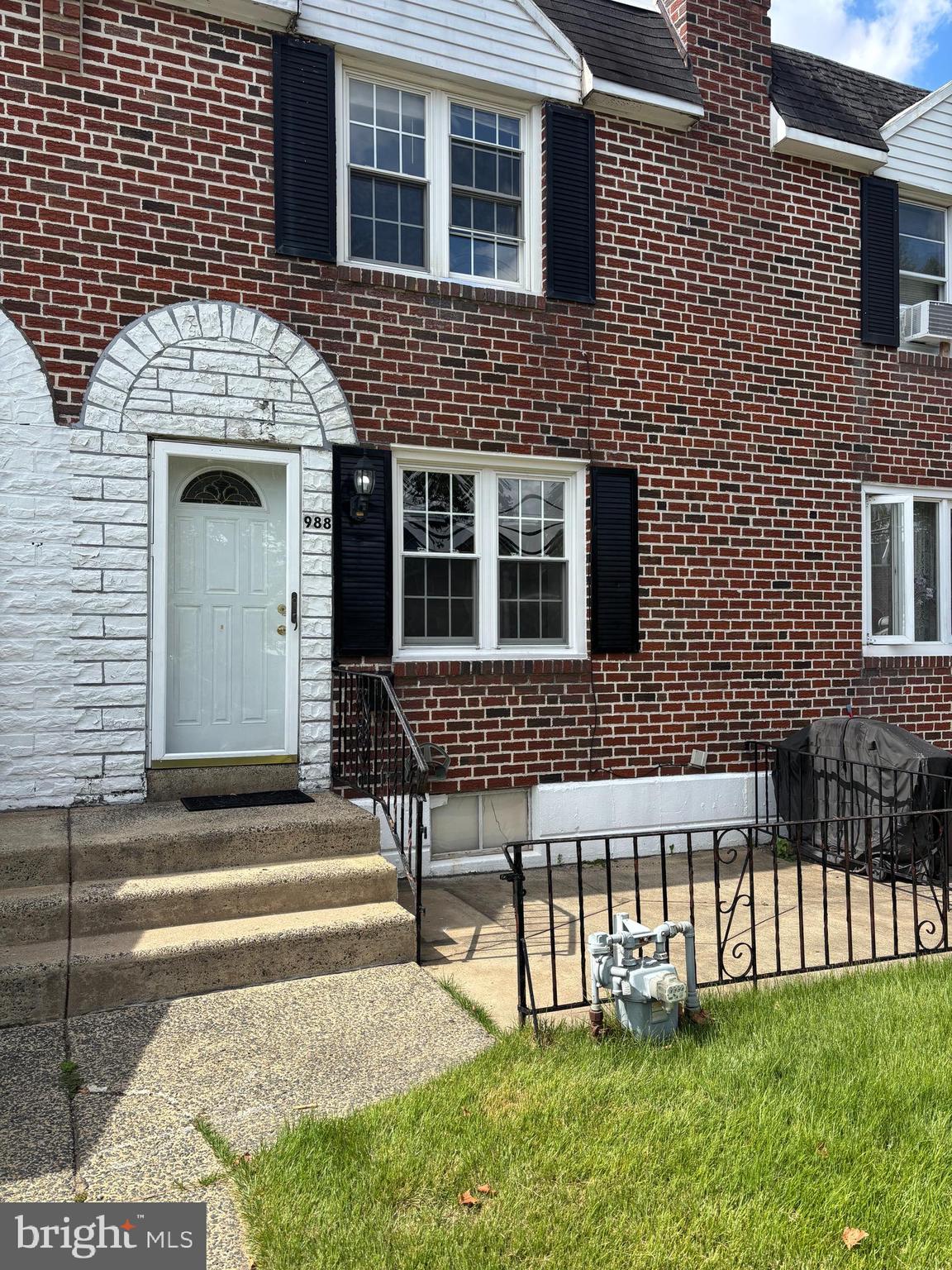 988 Grant Road Folcroft, PA 19032 - Photo 1 of 9 a front view of a house with a garden