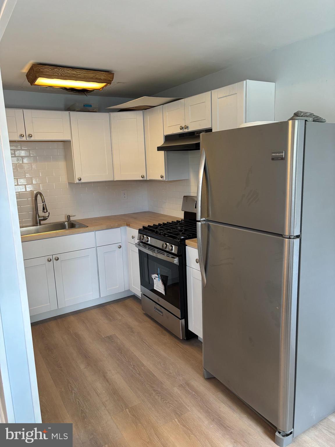 988 Grant Road Folcroft, PA 19032 - Photo 5 of 9 a kitchen with a refrigerator and a sink