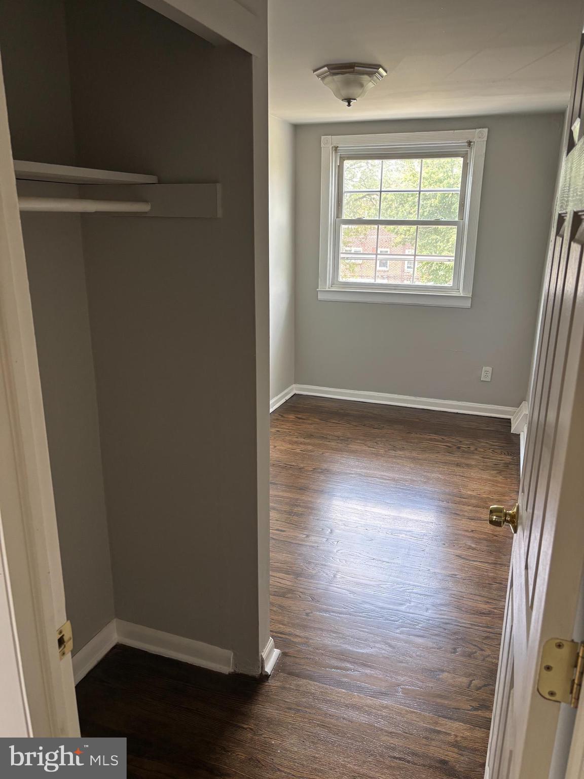 988 Grant Road Folcroft, PA 19032 - Photo 8 of 9 an empty room with wooden floor and windows