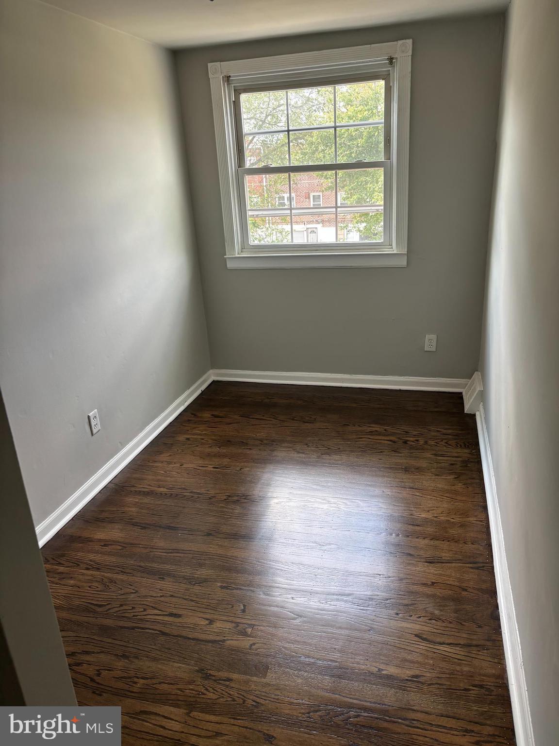 988 Grant Road Folcroft, PA 19032 - Photo 9 of 9 an empty room with wooden floor and windows