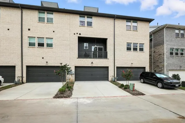 a front view of a house with parking space