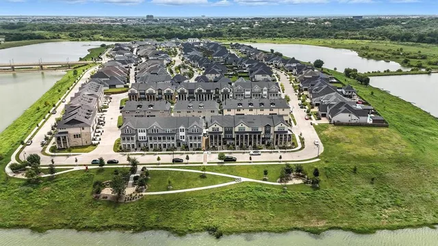 an aerial view of a house with a lake view