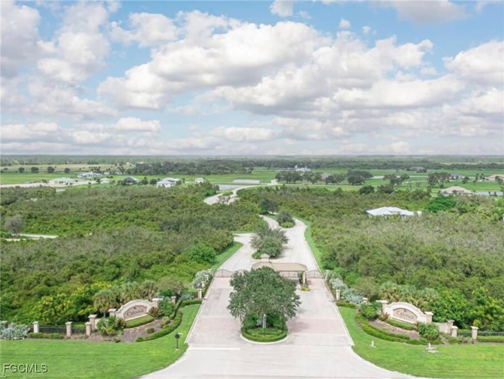 22742 Yellow Button Lane Alva, FL 33920 - Photo 3 of 3 a view of a city street next to a yard