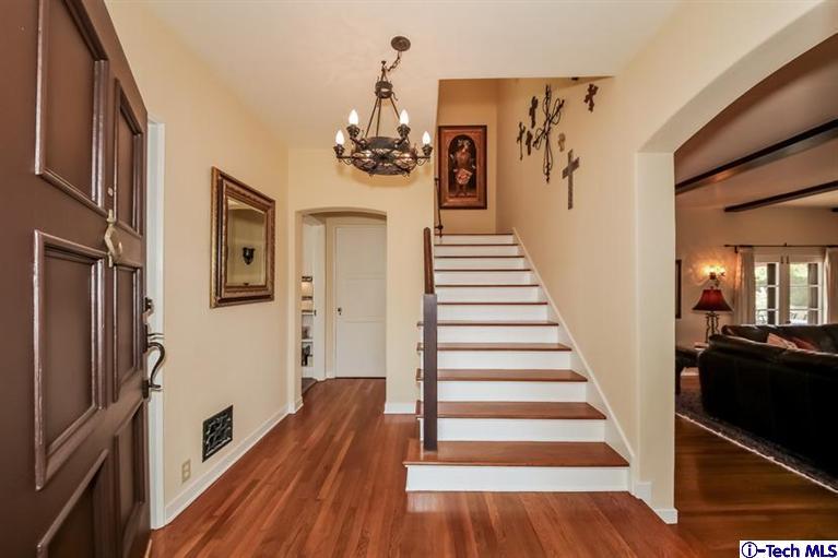1963 New York Drive Altadena, CA 91001 - Photo 2 of 38 a view of a hallway with wooden floor and staircase