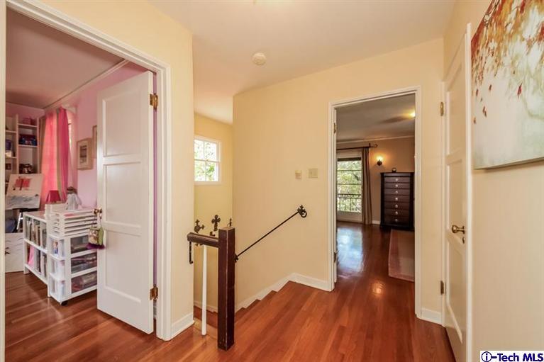 1963 New York Drive Altadena, CA 91001 - Photo 14 of 38 a view of a hallway with wooden floor and stairs