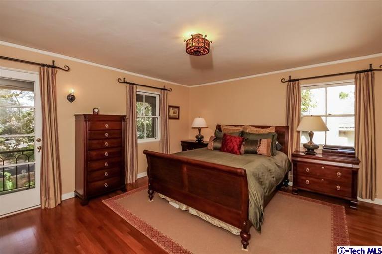 1963 New York Drive Altadena, CA 91001 - Photo 16 of 38 a bedroom with a bed and a dresser