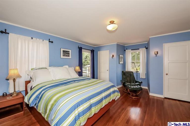 1963 New York Drive Altadena, CA 91001 - Photo 18 of 38 a bed room with a bed and a chair