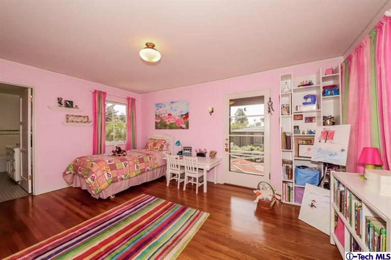 1963 New York Drive Altadena, CA 91001 - Photo 20 of 38 a bedroom with furniture and a book shelf