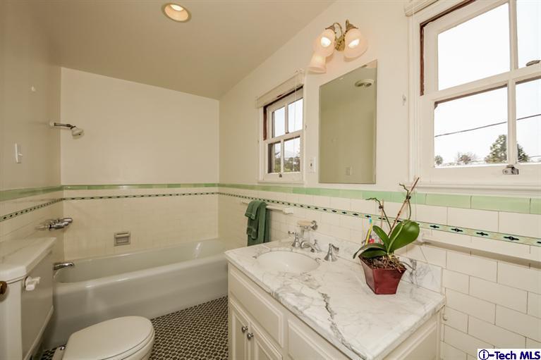 1963 New York Drive Altadena, CA 91001 - Photo 24 of 38 a bathroom with a sink a toilet and a bathtub