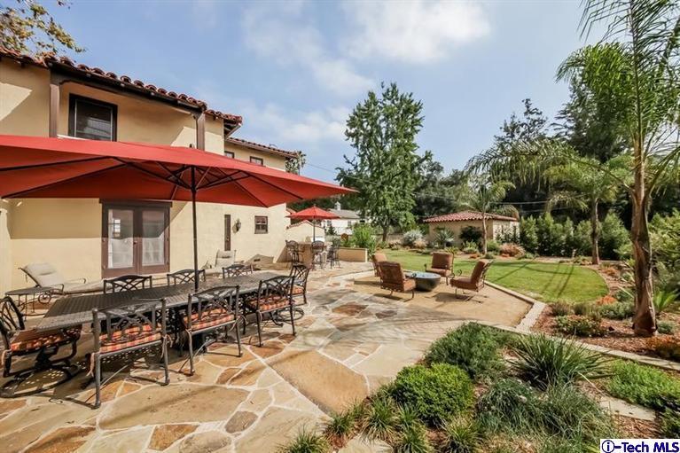 1963 New York Drive Altadena, CA 91001 - Photo 26 of 38 a view of patio with chairs and tables under an umbrella