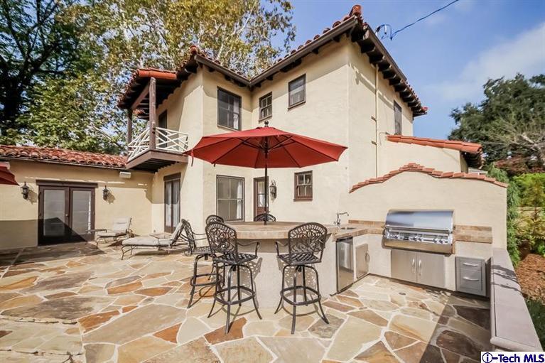 1963 New York Drive Altadena, CA 91001 - Photo 28 of 38 a view of a patio with a table and chairs under an umbrella