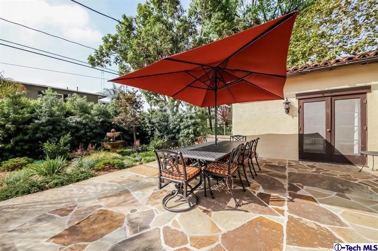 1963 New York Drive Altadena, CA 91001 - Photo 31 of 38 a view of backyard with seating space and wooden fence