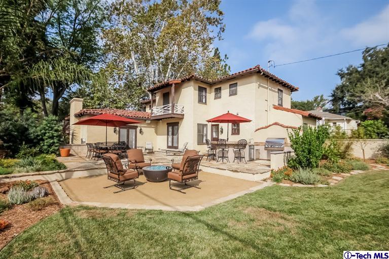 1963 New York Drive Altadena, CA 91001 - Photo 32 of 38 a view of a white house with a yard patio and fire pit