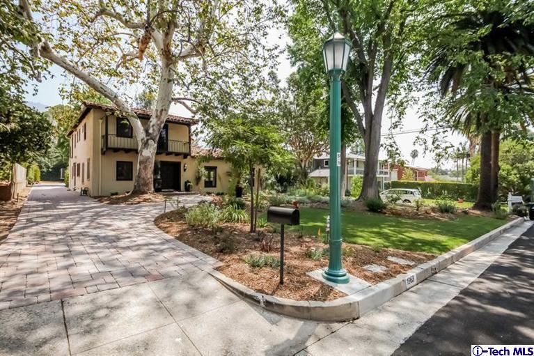 1963 New York Drive Altadena, CA 91001 - Photo 36 of 38 a backyard of a house with fountain table and chairs