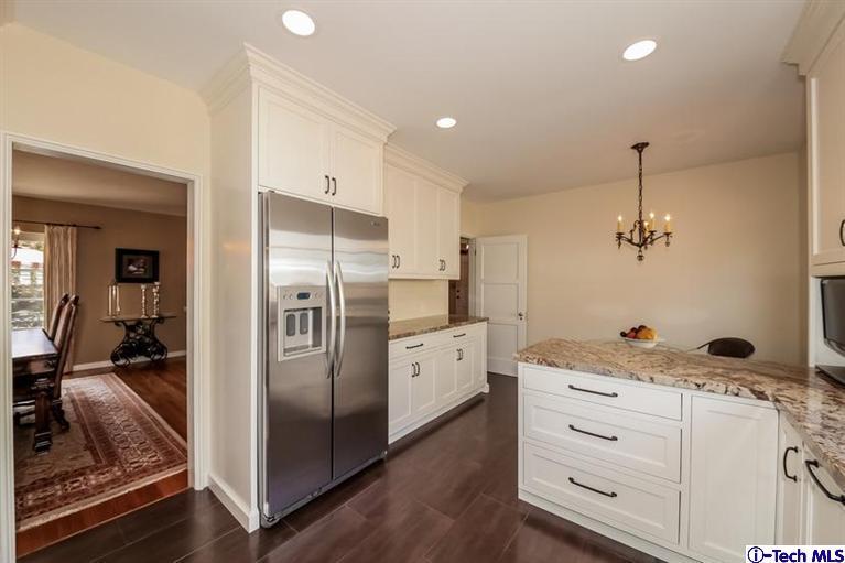 1963 New York Drive Altadena, CA 91001 - Photo 8 of 38 a kitchen with a refrigerator and countertop