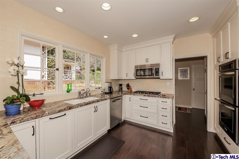 1963 New York Drive Altadena, CA 91001 - Photo 10 of 38 a kitchen with granite countertop a sink stainless steel appliances and cabinets