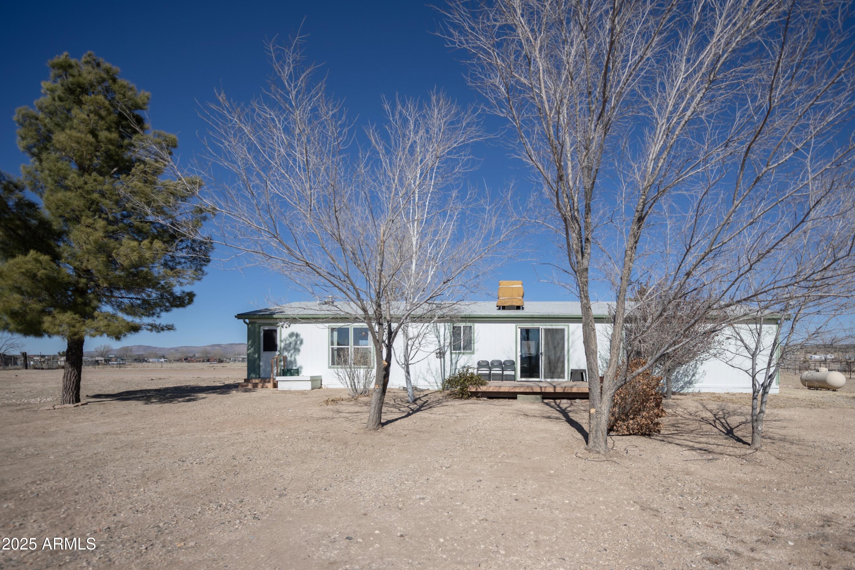 255 West Antelope Run Road Paulden, AZ 86334 - Photo 23 of 26 a view of a house with a large tree
