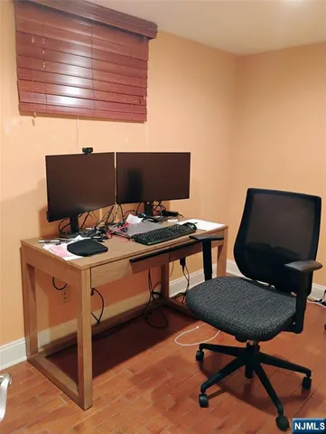 a view of a workspace with furniture