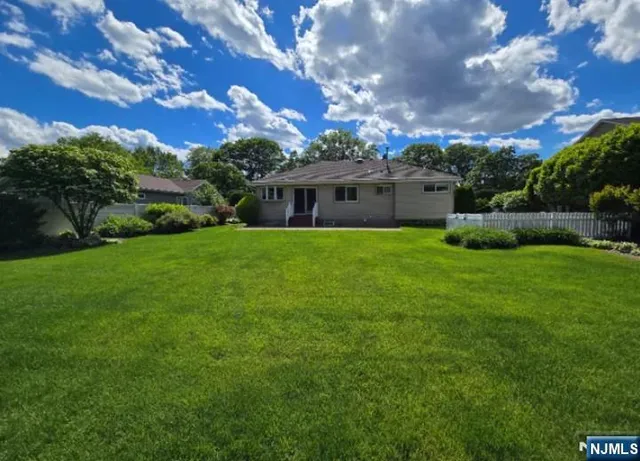a view of a house with a big yard