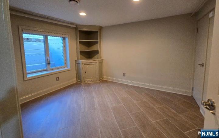 9 Harris Place, Unit 1X Fair Lawn, NJ 07410 - Photo 10 of 18 a view of an empty room and window