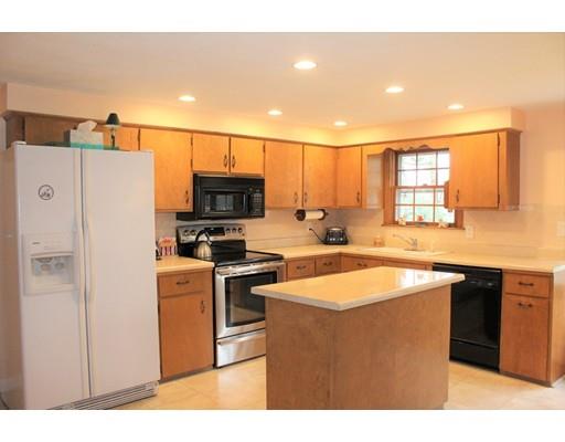 11 Indian Run Road Bellingham, MA 02019 - Photo 4 of 27 a kitchen with stainless steel appliances granite countertop a sink stove and refrigerator