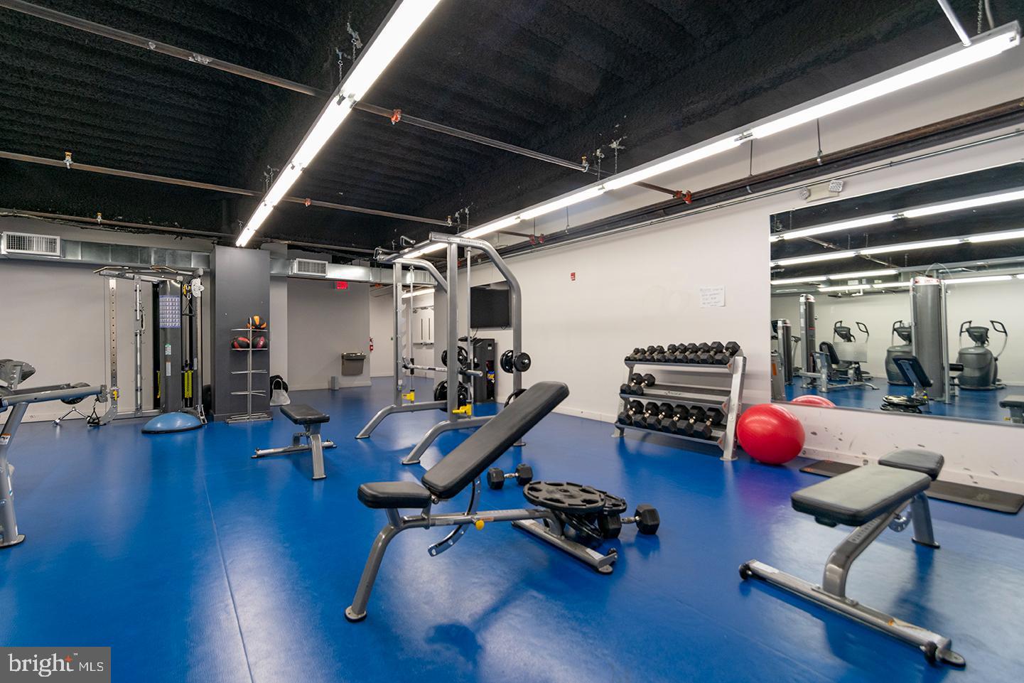 224 Church Street, Unit 215 Philadelphia, PA 19106 - Photo 10 of 15 a room with gym equipment and wooden floor