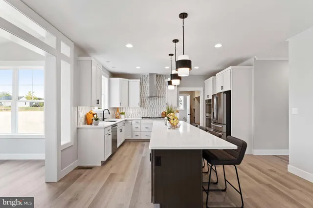 a bedroom with a bed and teddy bear on the floor