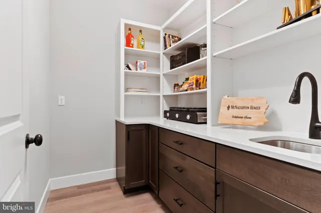 a living room with furniture fireplace and window
