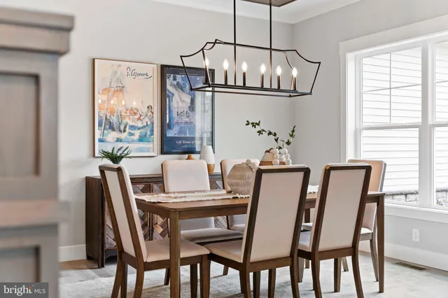 a dining room with furniture and window