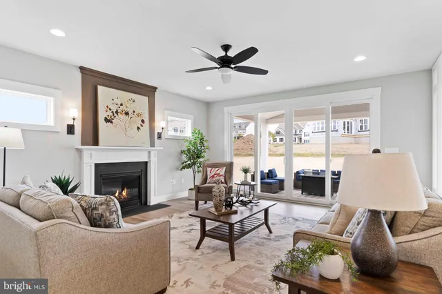 a spacious bathroom with a bathtub shower sink mirror and toilet