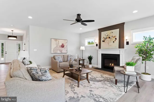 a en suite bathroom with a double vanity sink a mirror and a bathtub