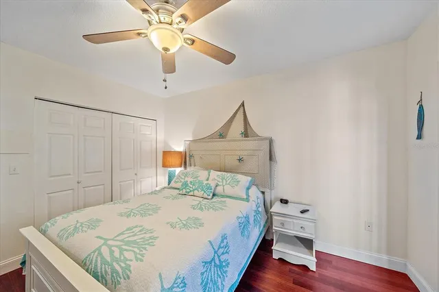a living room with stainless steel appliances furniture a rug and kitchen view