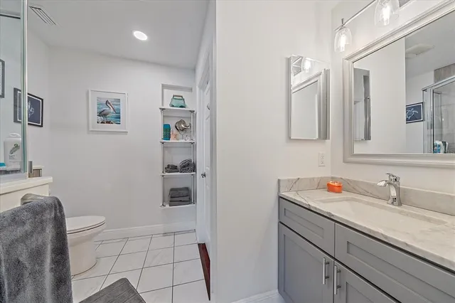 a large kitchen with a white cabinets and white appliances