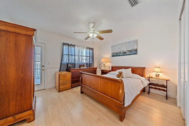 a dining room with furniture water view and a floor to ceiling window