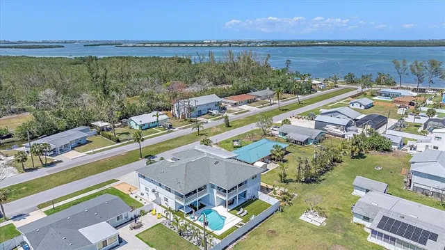 a view of a house with a yard porch and sitting area