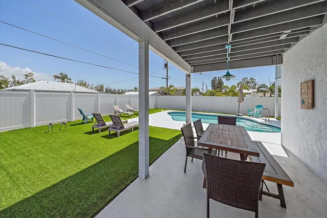 a view of a swimming pool with a lounge chair