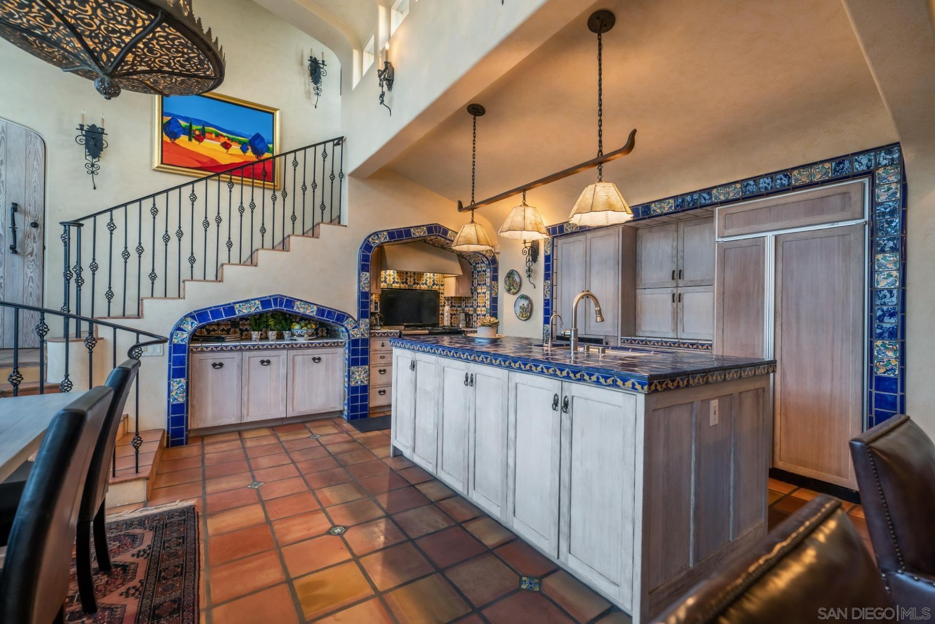 6174 El Tordo Rancho Santa Fe, CA 92067 - Photo 14 of 58 a kitchen with stainless steel appliances granite countertop a stove a sink and cabinets