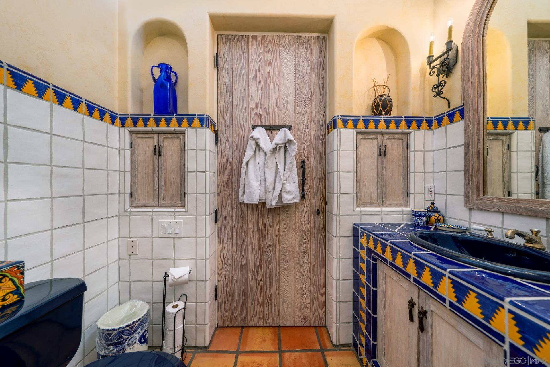 6174 El Tordo Rancho Santa Fe, CA 92067 - Photo 32 of 58 a bathroom with a sink and a mirror