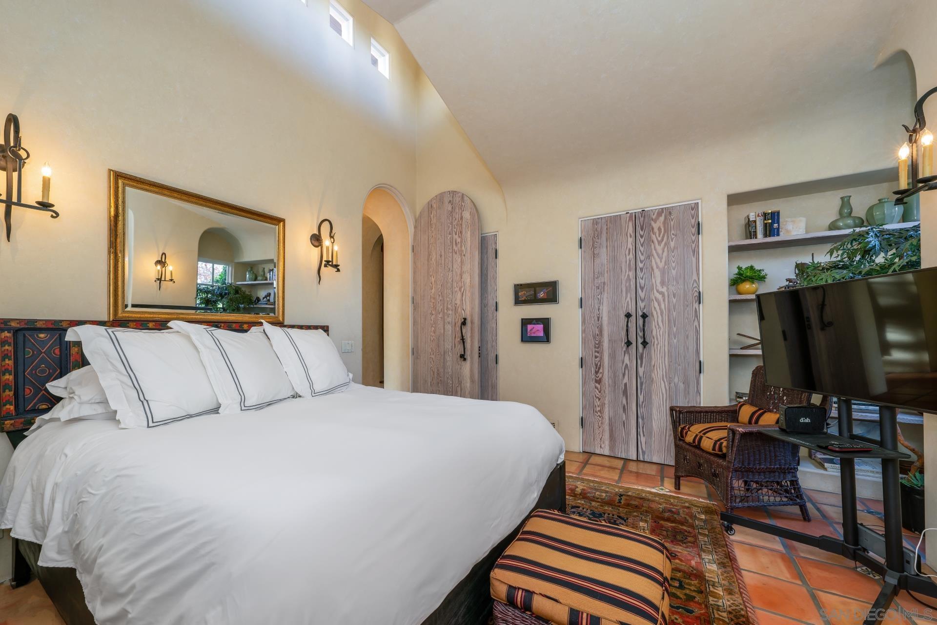 6174 El Tordo Rancho Santa Fe, CA 92067 - Photo 34 of 58 a bedroom with a bed and a flat tv screen on dresser