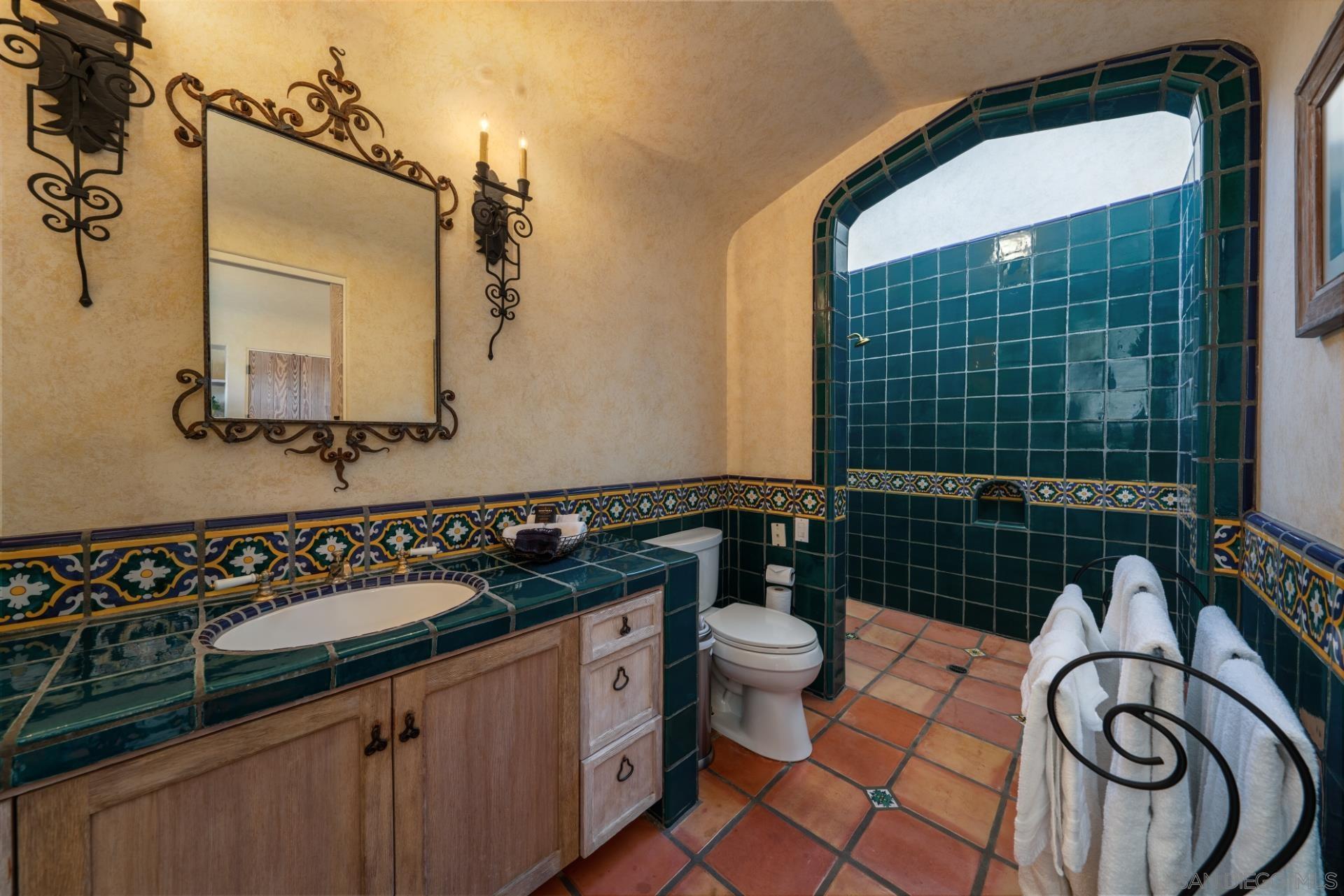 6174 El Tordo Rancho Santa Fe, CA 92067 - Photo 36 of 58 a bathroom with a sink and a mirror