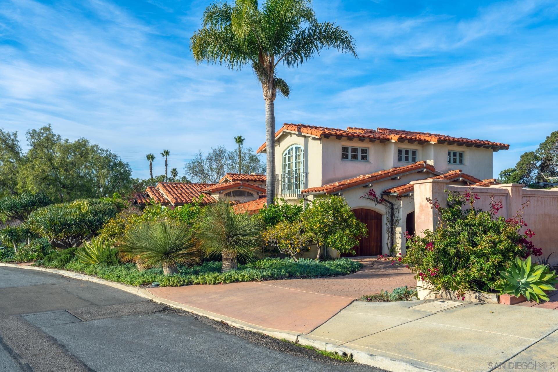 6174 El Tordo Rancho Santa Fe, CA 92067 - Photo 4 of 58 a front view of a house with a yard and potted plants