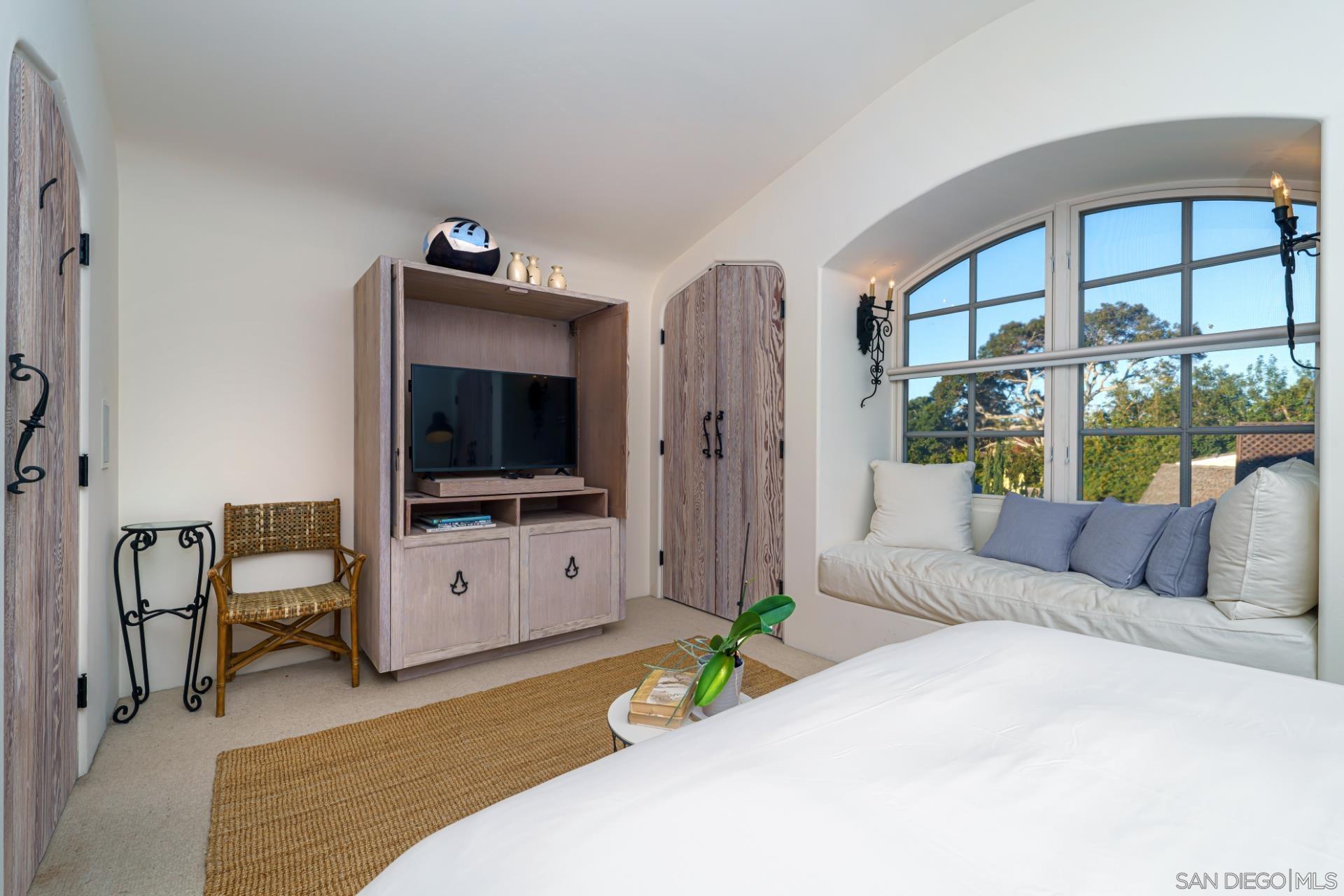 6174 El Tordo Rancho Santa Fe, CA 92067 - Photo 41 of 58 a living room with furniture and a flat screen tv