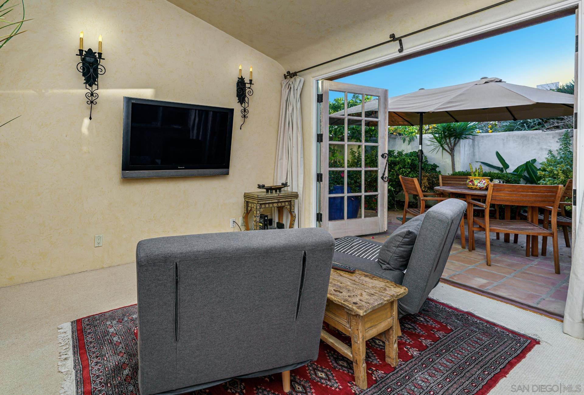 6174 El Tordo Rancho Santa Fe, CA 92067 - Photo 47 of 58 a living room with furniture and a flat screen tv