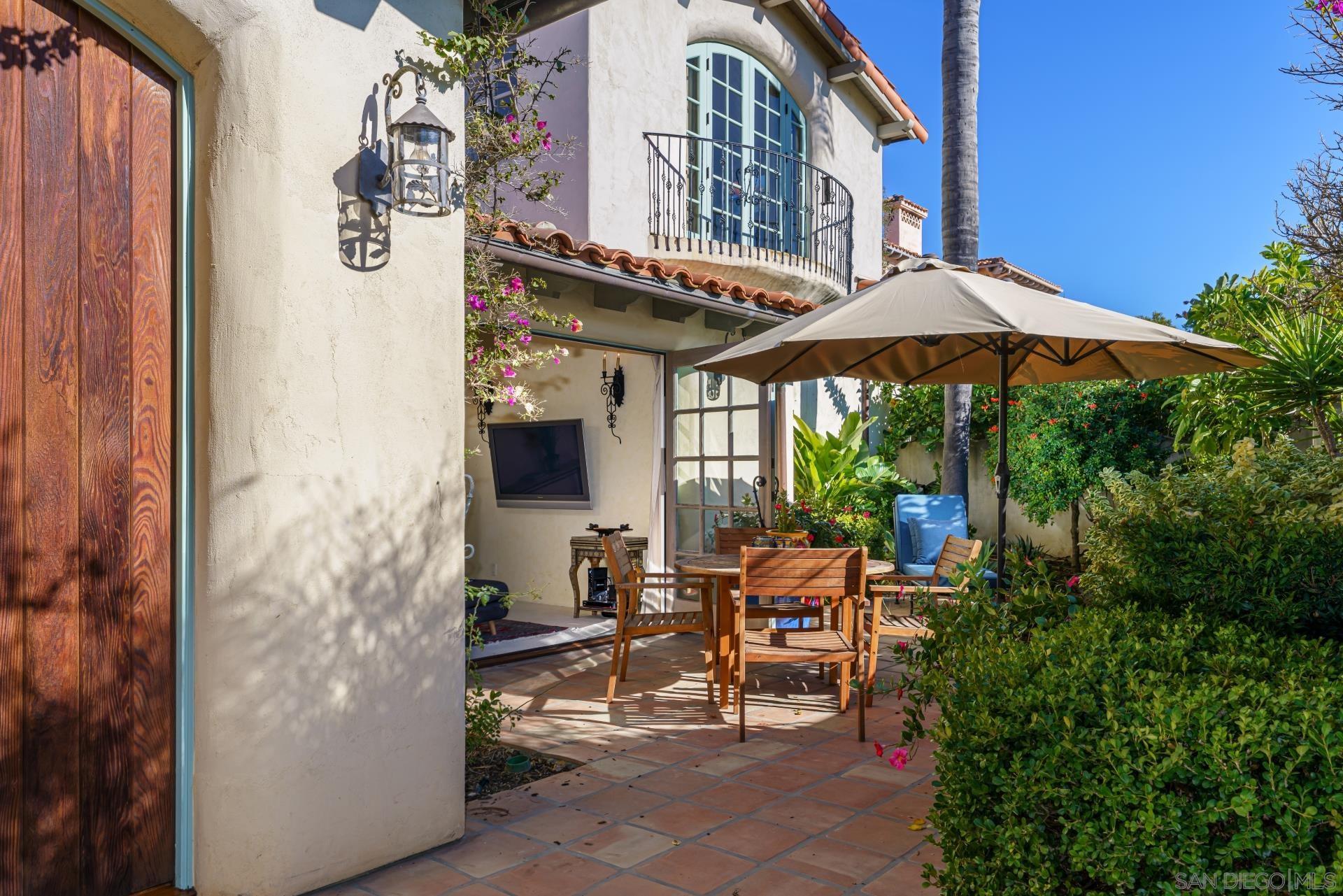 6174 El Tordo Rancho Santa Fe, CA 92067 - Photo 49 of 58 a view of a patio with table and chairs under an umbrella